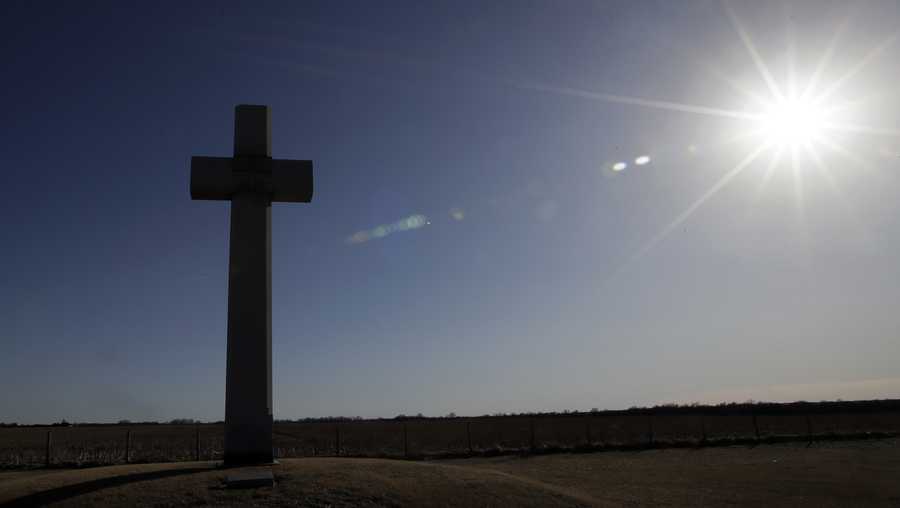 A cross, erected in memory of Fray Juan de Padilla, stands along US56 near Lyons, Kan., Tuesday, Feb. 12, 2019. The cross was a gift to the State of Kansas by the Knights of Columbus in 1950.