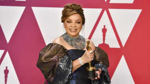 Ruth E. Carter poses with the award for best costume design for "Black Panther" in the press room at the Oscars on Sunday, Feb. 24, 2019, at the Dolby Theatre in Los Angeles.