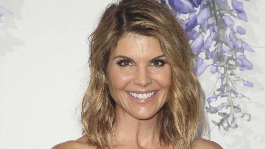 Full House star Lori Loughlin surrenders in college admissions scandal