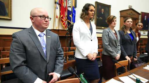 FILE - In this Feb. 27, 2019, file photo, from left, transgender military members Navy Lt. Cmdr. Blake Dremann, Army Capt. Alivia Stehlik, Army Capt. Jennifer Peace, Army Staff Sgt. Patricia King and Navy Petty Officer Third Class Akira Wyatt, listen before the start of a House Armed Services Subcommittee on Military Personnel hearing on Capitol Hill in Washington. The Defense Department has approved a new policy that will largely bar transgender troops and military recruits from transitioning to another sex, and require most individuals to serve in their birth gender.