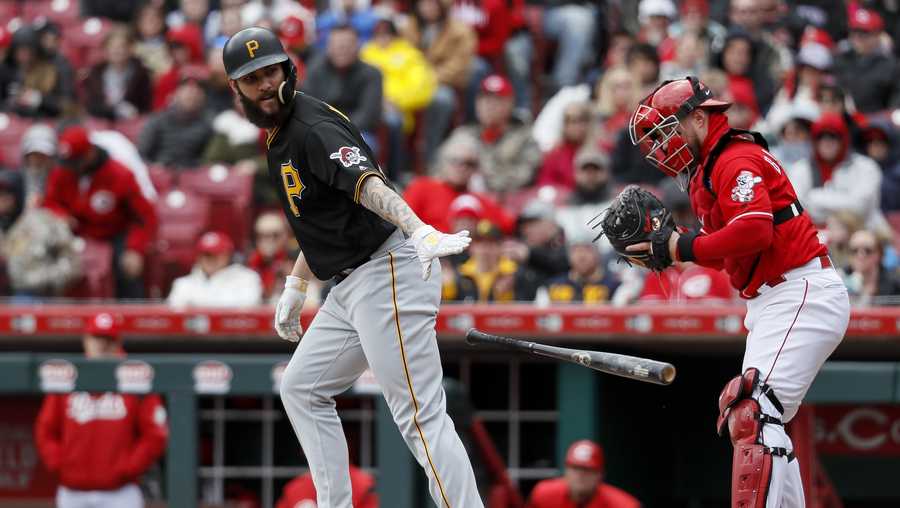 Pittsburgh Pirates' Trevor Williams, left, is walked by Cincinnati Reds starting pitcher Sonny Gray (not shown) with the bases loaded to force a run scored by Francisco Cervelli in the third inning of a baseball game, Sunday, March 31, 2019, in Cincinnati. (AP Photo/John Minchillo)