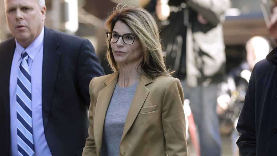 Lori Loughlin arrives at federal court in Boston on Wednesday, April 3, 2019, to face charges in a nationwide college admissions bribery scandal.