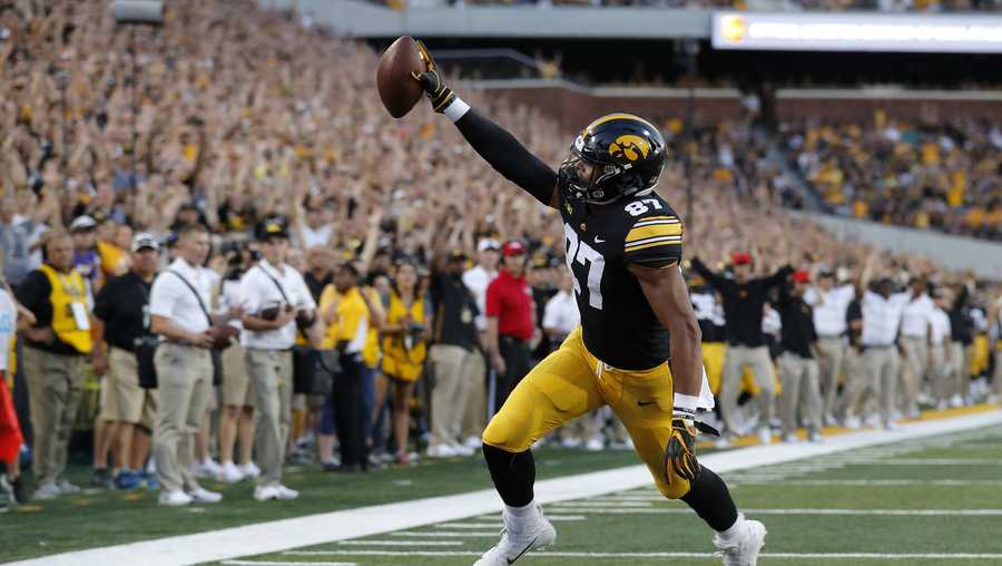 FILE - In this Sept. 15, 2018, file photo, Iowa tight end Noah Fant scores on a 5-yard touchdown pass during the first half of an NCAA college football game against Northern Iowa, in Iowa City, Iowa. Fant is a possible pick in the 2019 NFL Draft. (AP Photo/Charlie Neibergall, File)