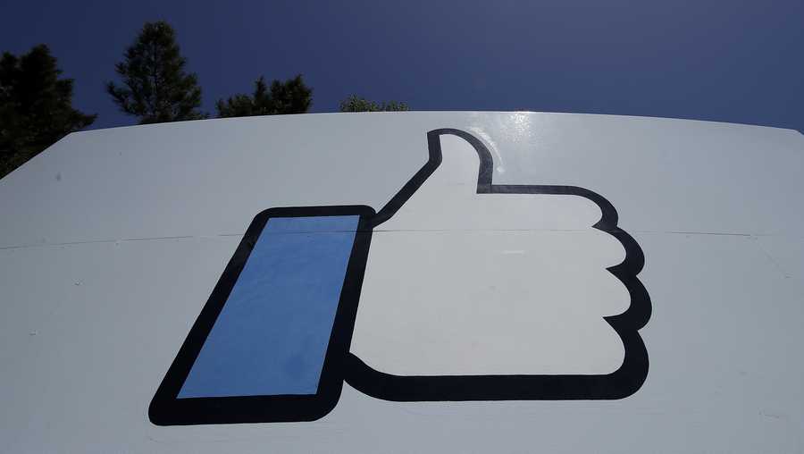 This April 25, 2019, photo shows the thumbs up Like logo on a sign at Facebook headquarters in Menlo Park, Calif. Facebook co-founder Chris Hughes says it’s time to break up the social media behemoth. He says in a New York Times opinion piece that CEO Mark Zuckerberg has allowed a relentless focus on growth that crushed competitors “to sacrifice security and civility for clicks.” (AP Photo/Jeff Chiu)