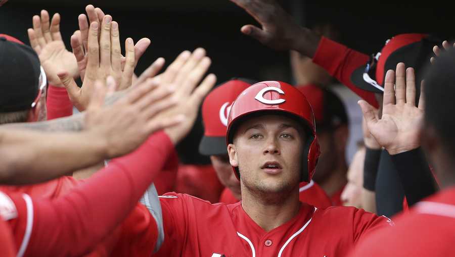 FILE - In this Monday, March 11, 2019 file photo, Cincinnati Reds' Nick Senzel (15) celebrates his run scored against the Cleveland Indians during the second inning of a spring training baseball game in Goodyear, Ariz. The Cincinnati Reds could bring up top prospect Nick Senzel before the Friday, May 3, 2019 game against San Francisco, putting the 23-year-old outfielder in position to make his major league debut against the Giants. (AP Photo/Ross D. Franklin, File)