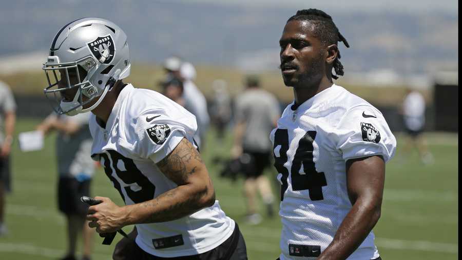 Oakland Raiders wide receivers Keelan Doss, left, and Antonio Brown warm up during NFL football minicamp Tuesday, June 11, 2019, in Alameda, Calif. (AP Photo/Eric Risberg)