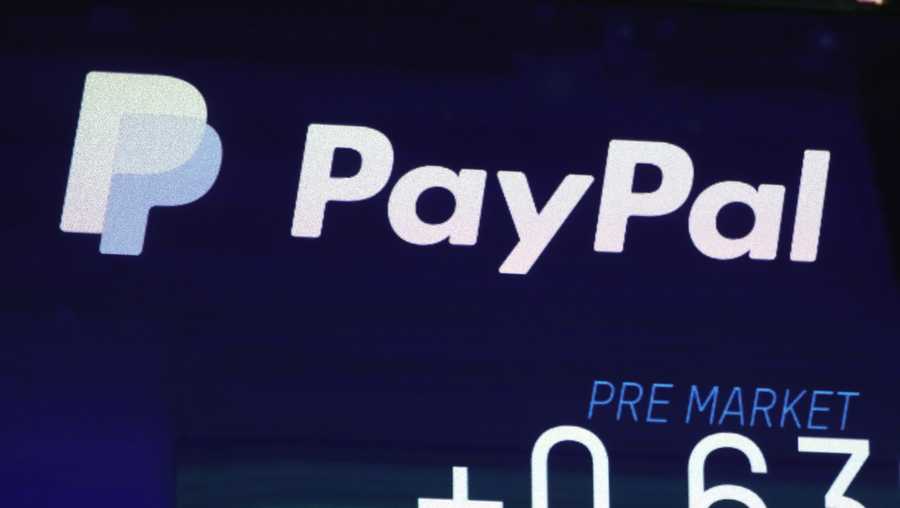 FILE - In this Oct. 3, 2018, file photo the PayPal logo appears on a screen at the Nasdaq MarketSite, in New York's Times Square. PayPal reports earning on Wednesday, July 24, 2019. (AP Photo/Richard Drew, File)