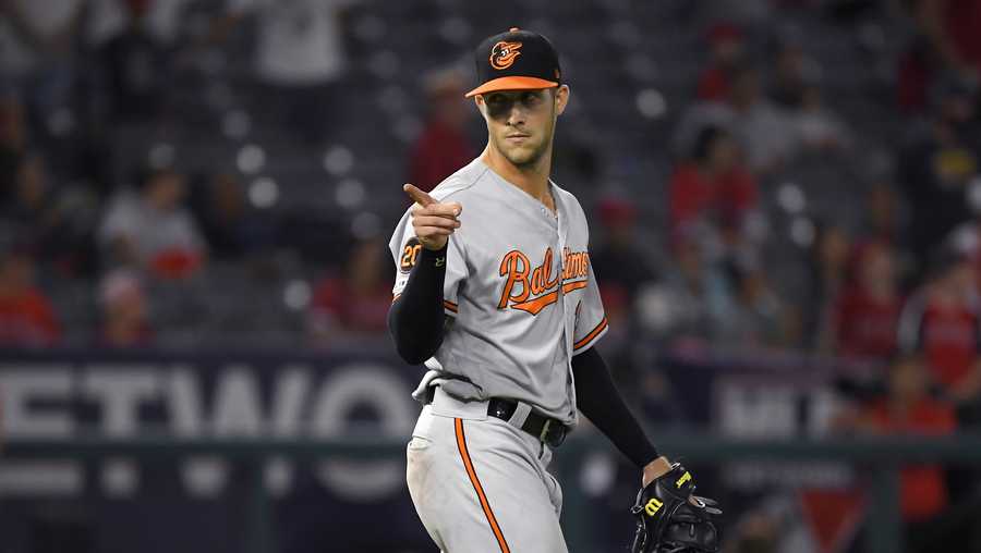 Baltimore Orioles outfielder Stevie Wilkerson gestures after the Orioles defeated the Los Angeles Angels 10-8 and pitching the 16th inning of a baseball game Friday, July 26, 2019, in Anaheim, Calif. (AP Photo/Mark J. Terrill)