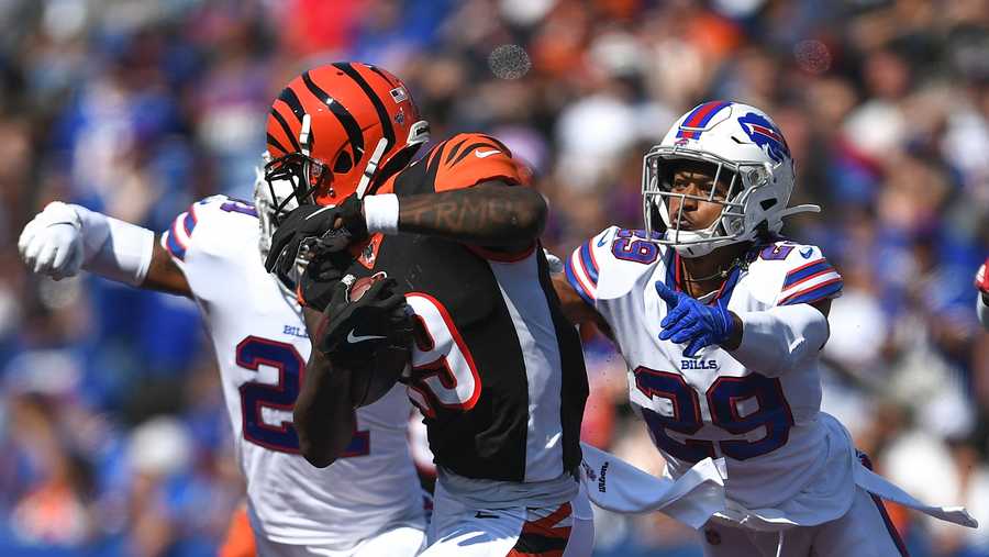 Buffalo Bills' Kevin Johnson (29) tackles Cincinnati Bengals' Auden Tate (19) during the first half of an NFL football game Sunday, Sept. 22, 2019, in Orchard Park, N.Y. (AP Photo/Adrian Kraus)