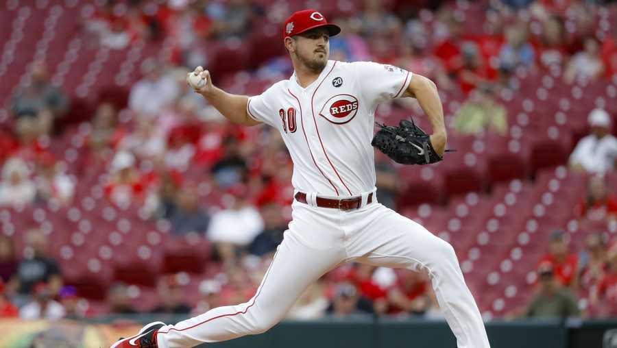 Cincinnati Reds starting pitcher Tyler Mahle throws during the first inning of the team's baseball game against the Milwaukee Brewers, Wednesday, Sept. 25, 2019, in Cincinnati. (AP Photo/John Minchillo)