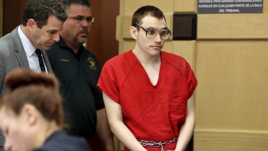 Florida school shooting defendant Nikolas Cruz enters the courtroom for a hearing at the Broward Courthouse, Tuesday, Dec. 10, 2019, in Fort Lauderdale, Fla. Broward Circuit Judge Elizabeth Scherer set a Dec. 19 date for arguments on the motion by defense lawyers who claim the case is moving much too swiftly and runs the risk of legal errors. That could mean a conviction of Cruz might be reversed on appeal, sending it back for another trial. (Amy Beth Bennett/South Florida Sun-Sentinel via AP, Pool)