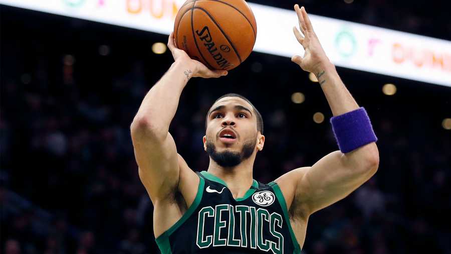 Boston Celtics' Jayson Tatum plays against the Houston Rockets in overtime during an NBA basketball game in Boston, Saturday, Feb. 29, 2020. (AP Photo/Michael Dwyer)