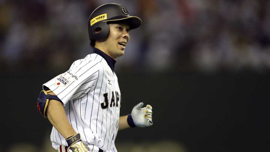 FILE -In this Nov. 21, 2015, file photo, Japan's Shogo Akiyama rounds third base after hitting two-run home run against Mexico in the seventh inning to end their third-place game at the Premier12 world baseball tournament at Tokyo Dome in Tokyo. Akiyama has agreed to a $21 million, three-year deal with the Cincinnati Reds, the only major league team that has not had a player born in Japan. Akiyama, 31, became a free agent after his ninth season with the Seibu Lions in Japan's Pacific League, where he was a five-time All-Star. (AP Photo/Toru Takahashi, File)