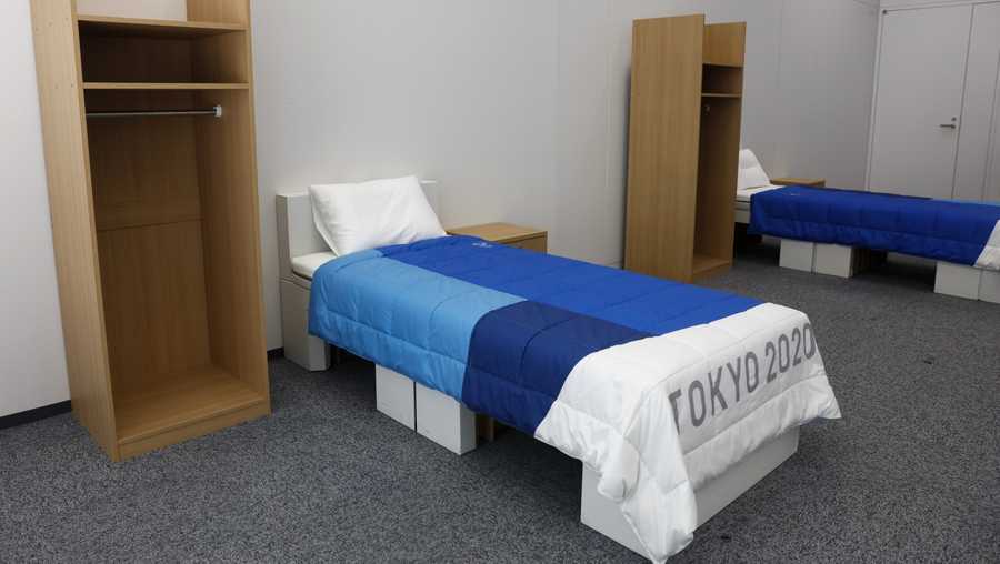 Two sets of bedroom furniture, including cardboard beds, for the Tokyo 2020 Olympic and Paralympic Villages are shown in a display room Thursday, Jan. 9, 2020, in Tokyo.