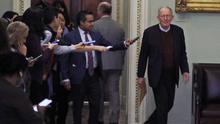 Sen. Lamar Alexander, R-Tenn., walks out of the Senate chambers during a break in the impeachment trial of President Donald Trump at the U.S. Capitol Thursday Jan 30, 2020, in Washington.