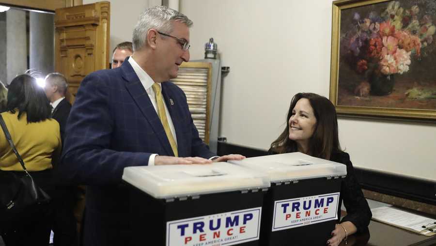 Second lady Karen Pence speaks with Indiana Gov. Eric Holcomb at the Statehouse after delivering paperwork putting President Donald Trump's name on the Indiana primary ballot, Wednesday, Feb. 5, 2020, in Indianapolis. (AP Photo/Darron Cummings)