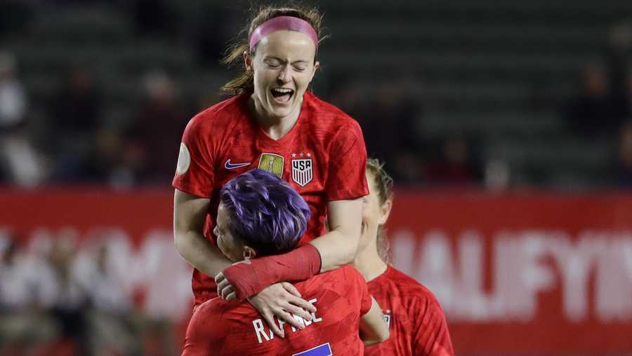 U.S. midfielder Rose Lavelle, top, celebrates with forward Megan Rapinoe after scoring against Mexico during the first half of a CONCACAF women's Olympic qualifying soccer match Friday, Feb. 7, 2020, in Carson, Calif. (AP Photo/Chris Carlson)
