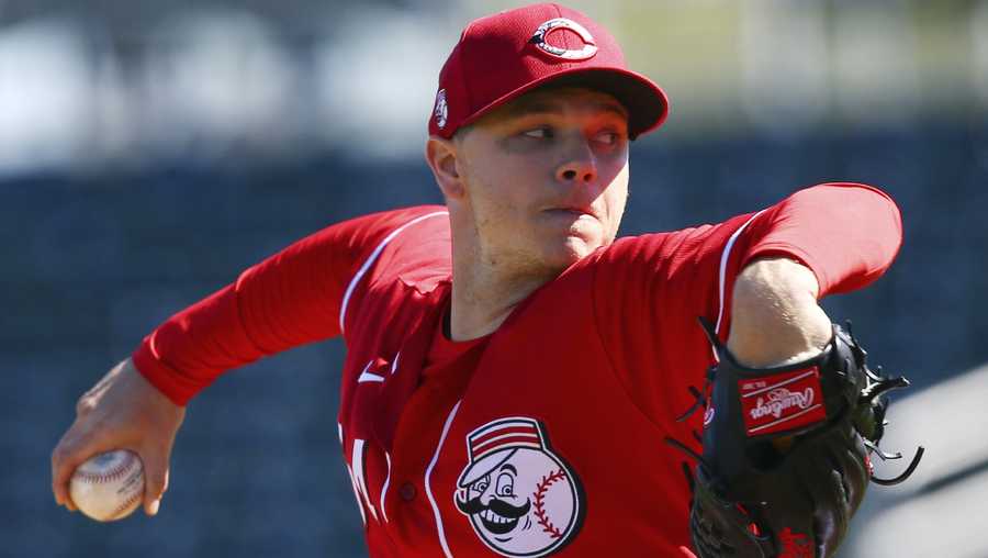 Cincinnati Reds starting pitcher Sonny Gray throws against the Seattle Mariners during the first inning of a spring training baseball game Wednesday, Feb. 26, 2020, in Goodyear, Ariz. (AP Photo/Ross D. Franklin)