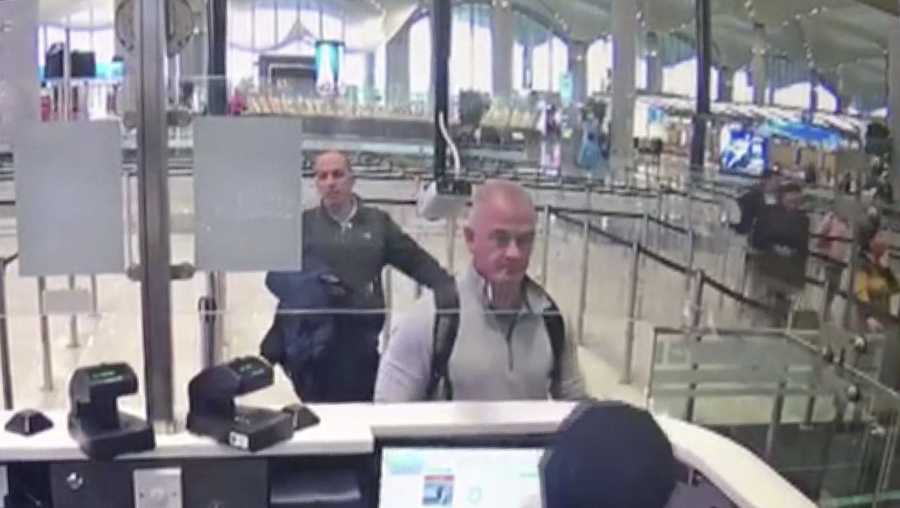 This Dec. 30, 2019 image from security camera video shows Michael L. Taylor, center, and George-Antoine Zayek at passport control at Istanbul Airport in Turkey. Taylor, a former Green Beret and his son, Peter Taylor, 27, were arrested Wednesday, May 20, 2020 in Massachusetts on charges they smuggled Nissan Motor Co. Chairman Carlos Ghosn out of Japan in a box in December 2019, while he awaited trial there on financial misconduct charges. (DHA via AP)