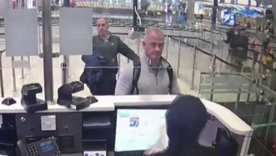 This Dec. 30, 2019 image from security camera video shows Michael L. Taylor, center, and George-Antoine Zayek at passport control at Istanbul Airport in Turkey. Taylor, a former Green Beret and his son, Peter Taylor, 27, were arrested Wednesday, May 20, 2020 in Massachusetts on charges they smuggled Nissan Motor Co. Chairman Carlos Ghosn out of Japan in a box in December 2019, while he awaited trial there on financial misconduct charges. (DHA via AP)