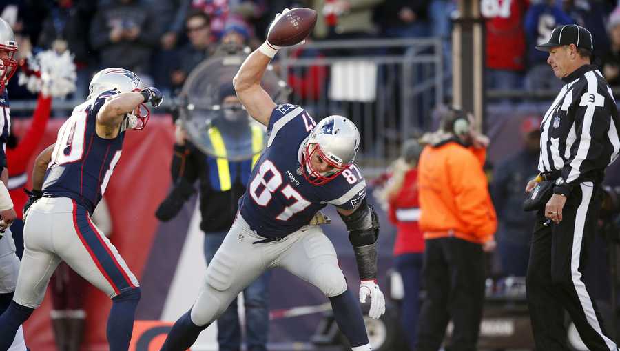 New England Patriots tight end Rob Gronkowski (87) spikes the ball after scoring a touchdown during the first half of an NFL football game against the Miami Dolphins, Sunday, Nov. 26, 2017, in Foxborough, Mass.
