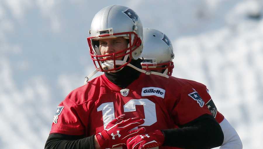 New England Patriots Tom Brady stretches during practice before