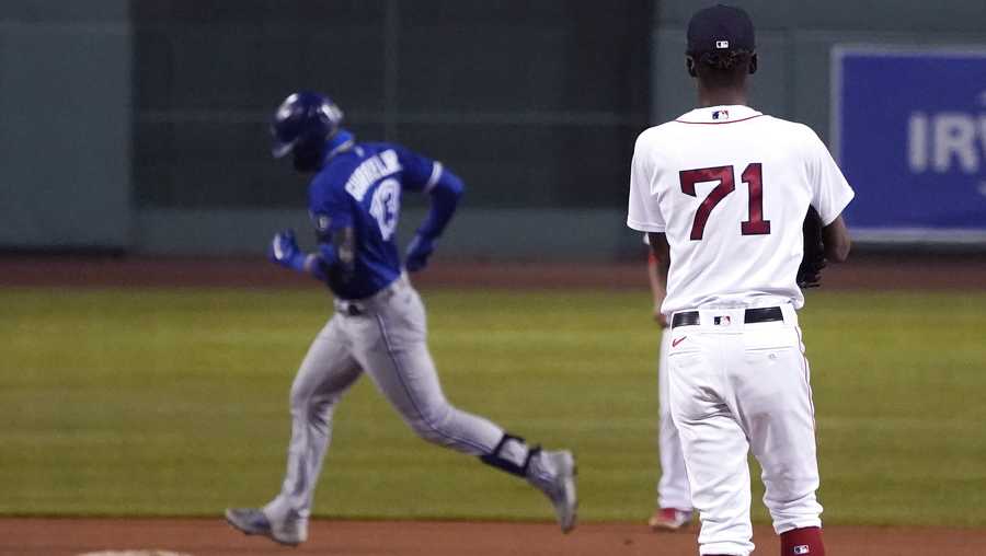 Boston Red Sox relief pitcher Phillips Valdez (71) waits as Toronto Blue Jays&apos; Lourdes Gurriel Jr. runs the bases on a solo home run during the 10th inning of a baseball game Thursday Sept. 3, 2020, in Boston. (AP Photo/Charles Krupa)