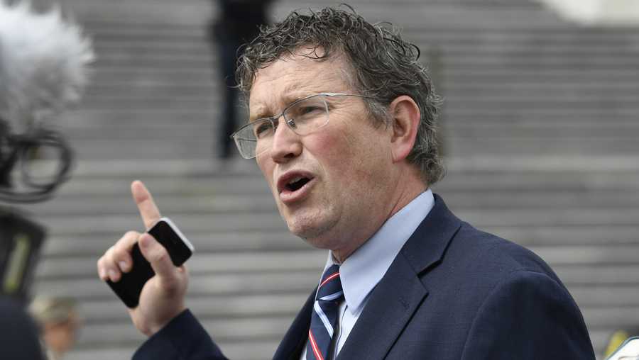 FILE - In this March 27, 2020 file photo Rep. Thomas Massie, R-Ky., talks to reporters before leaving Capitol Hill in Washington. Massie, a Kentucky congressman said Kyle Rittenhouse charged with fatally shooting two people with a semi-automatic rifle during the unrest in Wisconsin showed “incredible restraint" and acted in self-defense. (AP Photo/Susan Walsh, File)