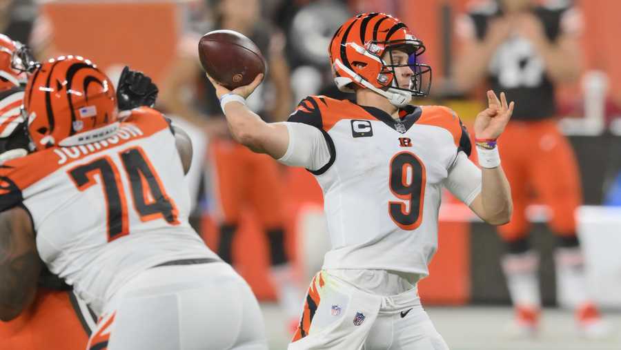 Cincinnati Bengals quarterback Joe Burrow throws a 23-yard touchdown pass to tight end C.J. Uzomah during the first half of an NFL football game against the Cleveland Browns, Thursday, Sept. 17, 2020, in Cleveland. The touchdown pass was the first one of Burrow&apos;s career.  (AP Photo/David Richard)