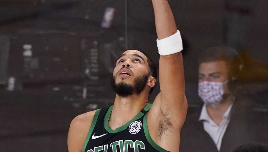 Boston Celtics' Jayson Tatum (0) prepares for the start of an NBA conference final playoff basketball game between the Celtics and the Miami Heat Friday, Sept. 25, 2020, in Lake Buena Vista, Fla. (AP Photo/Mark J. Terrill)