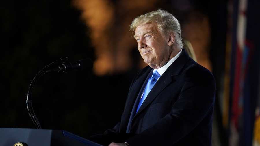 President Donald Trump speaks before Supreme Court Justice Clarence Thomas administers the Constitutional Oath to Amy Coney Barrett on the South Lawn of the White House in Washington, Monday, Oct. 26, 2020, after she was confirmed by the Senate earlier in the evening. (AP Photo/Patrick Semansky)