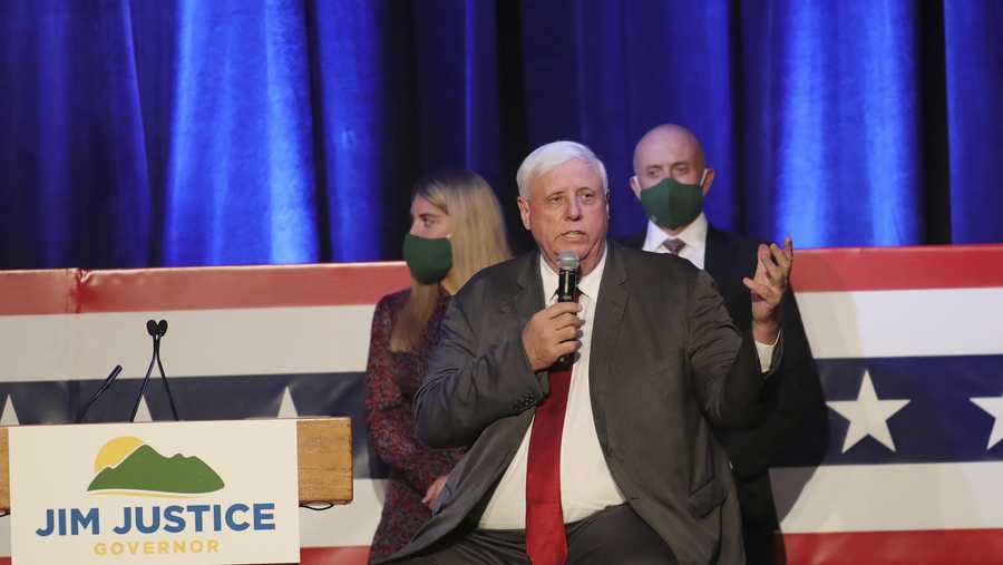 West Virginia Gov. Jim Justice celebrates his reelection at The Greenbrier Resort, Tuesday, Nov. 3, 2020, in White Sulphur Springs, W.Va.  Justice and his staff are being tested for the coronavirus after a staffer in the capitol building tested positive on Friday, Nov. 6. Justice says he was tested minutes before a noon press conference where he announced a record 540 new coronavirus cases in the past day. (AP Photo/Chris Jackson)