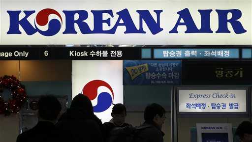 In this Dec. 16, 2014 photo, passengers wait to check in at the domestic check-in desk of Korean Air Lines Co. at Gimpo Airport in Seoul, South Korea.