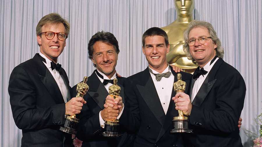 From left, Mark Johnson, Dustin Hoffman, Tom Cruise and Barry Levinson are all smiles as they display their "Oscars"  in Los Angeles, March 29, 1989 after "Rain Man" was named best film. This was the 61st Annual Academy Awards.   (AP Photo)