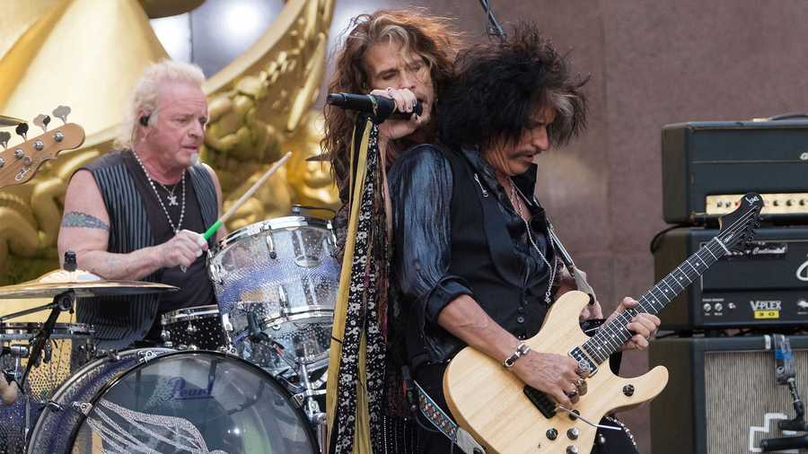 Joey Kramer, from left, Steven Tyler and Joe Perry of Aerosmith perform on NBC's "Today" show at Rockefeller Center on Wednesday, Aug. 15, 2018, in New York. (Photo by Charles Sykes/Invision/AP)