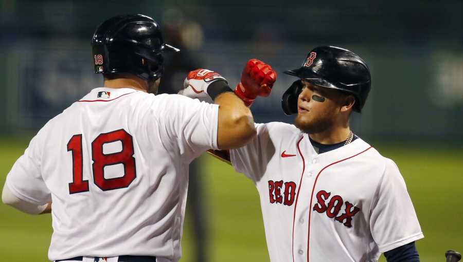 Boston Red Sox&apos;s Mitch Moreland (18) celebrates his two-run home run with Alex Verdugo during the third inning of a baseball game against the Toronto Blue Jays, Friday, Aug. 7, 2020, in Boston. (AP Photo/Michael Dwyer)