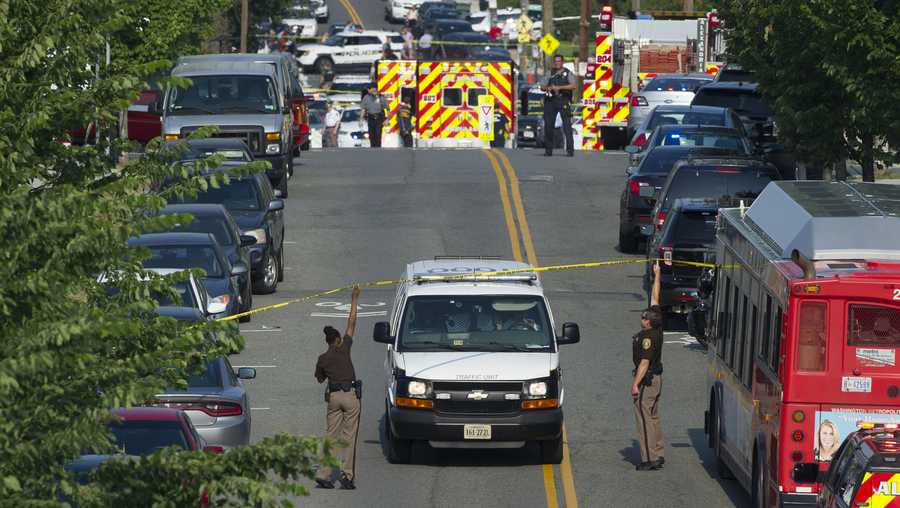Police and emergency personnel are seen near the scene where House Majority Whip Steve Scalise of La. was shot during a Congressional baseball practice in Alexandria, Va., Wednesday, June 14, 2017.