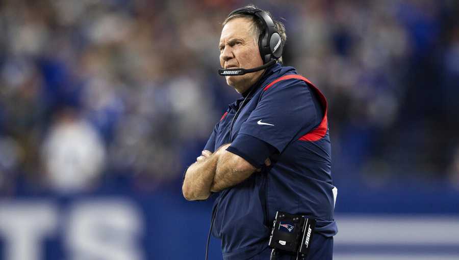 New England Patriots head coach Bill Belichick on the sidelines during an NFL football game against the Indianapolis Colts, Saturday, Dec. 18, 2021, in Indianapolis. (AP Photo/Zach Bolinger)