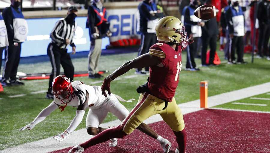 Boston College wide receiver CJ Lewis (11) makes a touchdown reception against Louisville cornerback Kei&apos;Trel Clark during the second half of an NCAA college football game, Saturday, Nov. 28, 2020, in Boston. (AP Photo/Michael Dwyer)