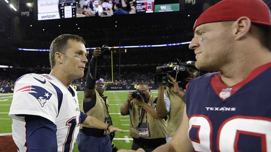 New England Patriots quarterback Tom Brady, left, greets Houston Texans defensive end J.J. Watt, right, following an NFL football preseason game Saturday, Aug. 19, 2017, in Houston.