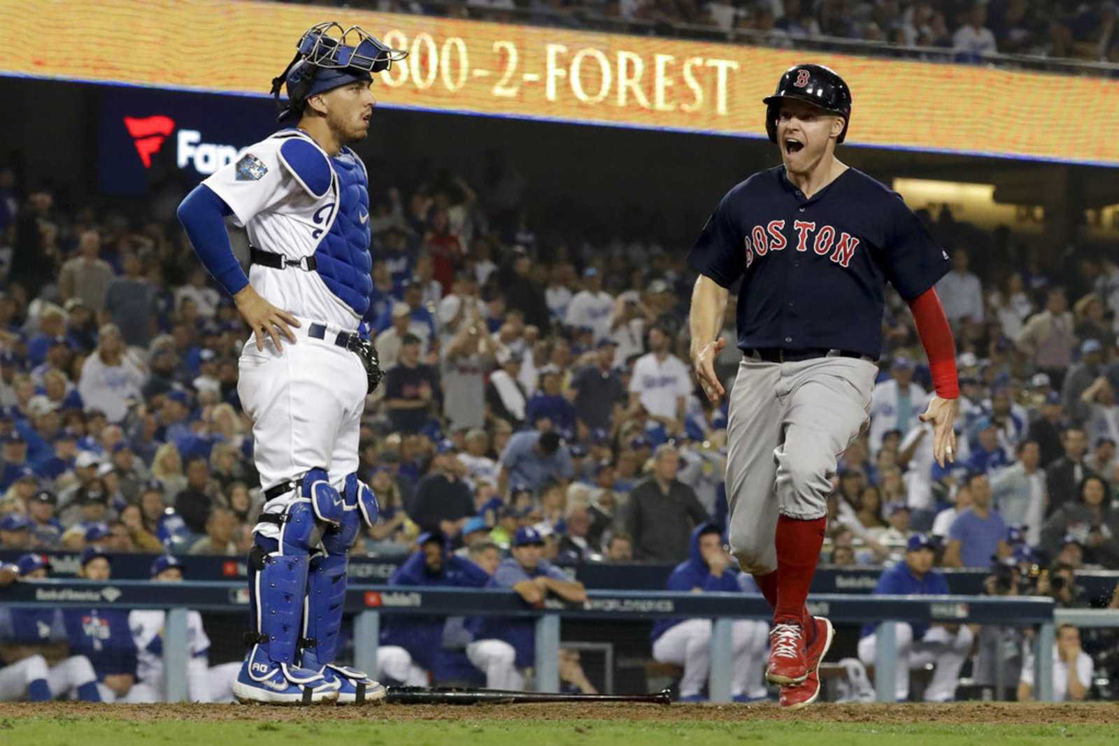 Boston Red Sox Brock Holt tags out Los Angeles Dodgers' Cody