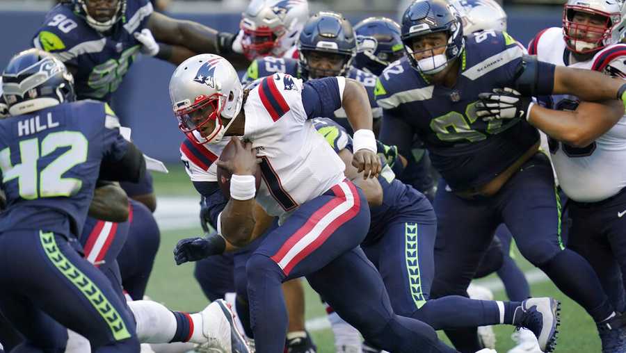 New England Patriots quarterback Cam Newton (1) rushes for a touchdown against the Seattle Seahawks during the first half of an NFL football game, Sunday, Sept. 20, 2020, in Seattle. (AP Photo/Elaine Thompson)