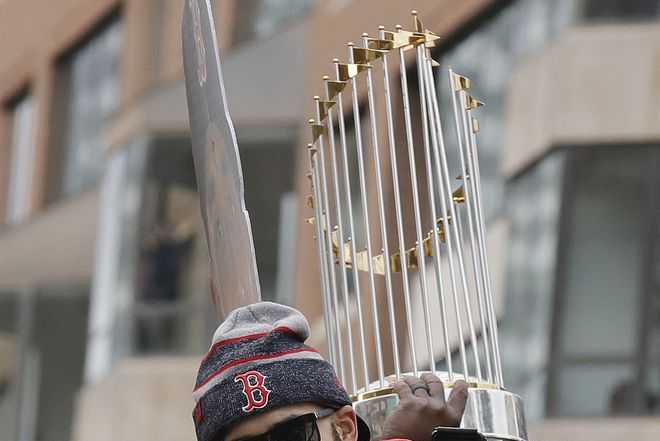 Beer can breaks trophy during Red Sox World Series parade 