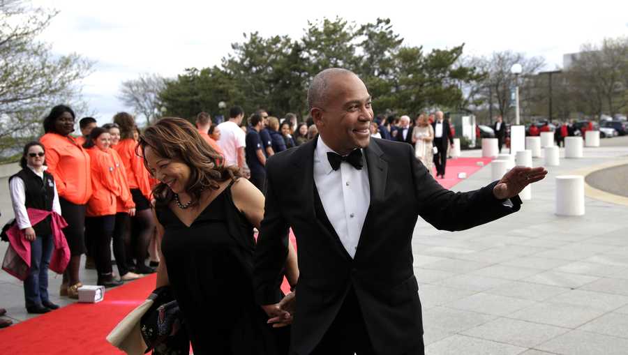 Former Massachusetts Governor Deval Patrick, right, arrives with his wife, Diane, at the John F. Kennedy Presidential Library and Museum before the 2017 Profile in Courage award Sunday, May 7, 2017, in Boston. Former President Barack Obama  was presented with the award during the ceremonies. (AP Photo/Steven Senne)