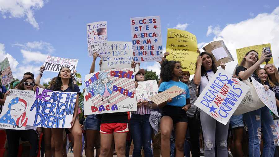 Supporters of Deferred Action for Childhood Arrival program (DACA) demonstrate on Pennsylvania Avenue in front of the White House in Washington, Saturday, Sept. 9, 2017. President Donald Trump ordered and end of protections for young immigrants who were brought into the country illegally as children, but gave Congress six months to act on it.