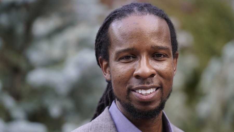 Ibram X. Kendi, director of Boston University&apos;s Center for Antiracist Research, stands for a portrait Wednesday, Oct. 21, 2020, in Boston. (AP Photo/Steven Senne)