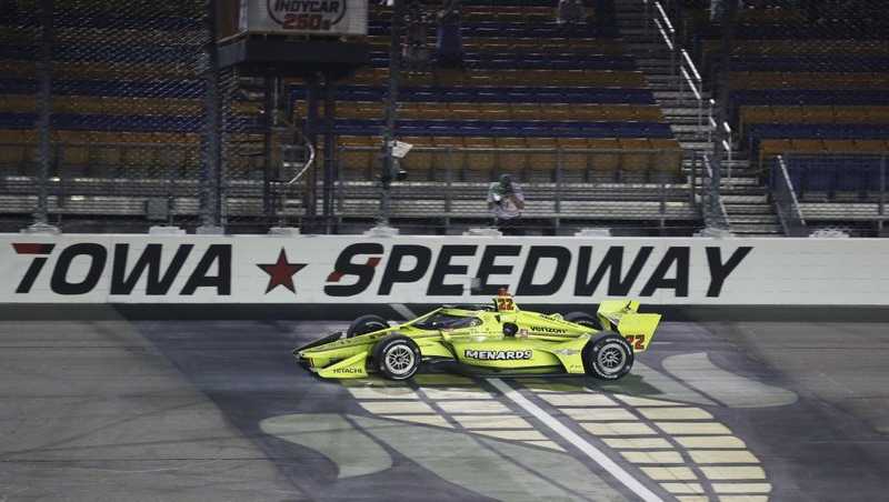 Simon Pagenaud, of France, crosses the finish line as he wins an IndyCar series auto-race Friday, July 17th, 2020, at Iowa Speedway in Newton, Iowa