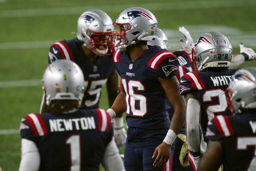 Cam Newton helps Patriots beat Ravens in rain and wind