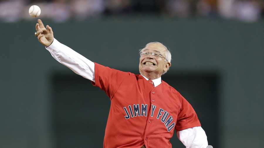 Veteran Boston Red Sox radio broadcaster Joe Castiglione throws a ceremonial first pitch prior to a baseball game against the New York Yankees at Fenway Park in Boston Wednesday, Sept. 12, 2012. (AP Photo/Elise Amendola)
