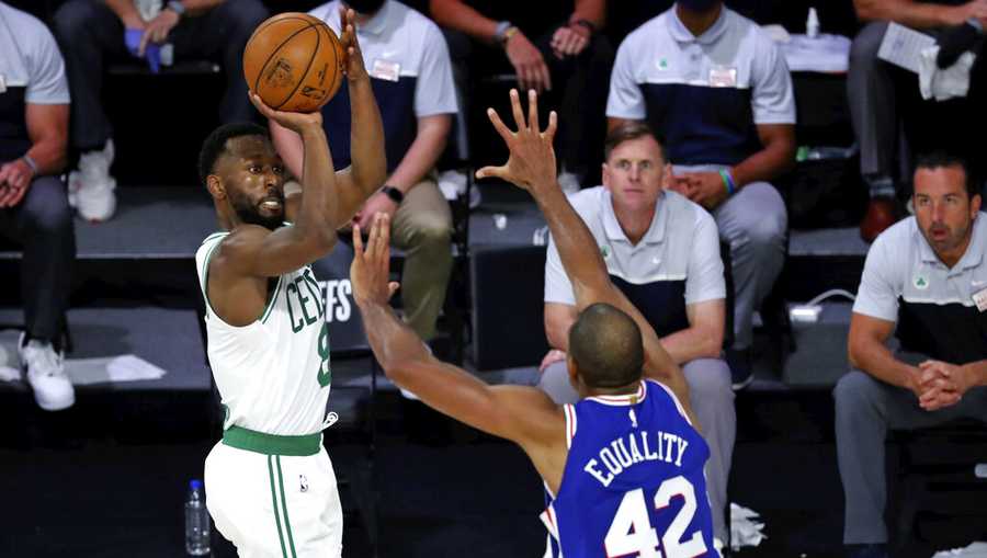 Boston Celtics guard Kemba Walker (8) shoots over Philadelphia 76ers forward Al Horford (42) during the second half in Game 3 of an NBA basketball first-round playoff series, Friday, Aug. 21, 2020, in Lake Buena Vista, Fla. (Kim Klement/Pool Photo via AP)